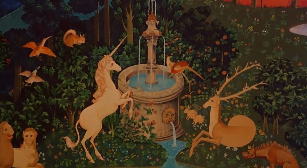 Enchanted garden scene with mythical creatures including a unicorn and deer gathered around a central fountain with blue water, surrounded by lush vegetation and flowering plants